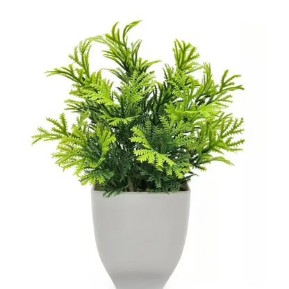 Planta artificial en maceta blanca